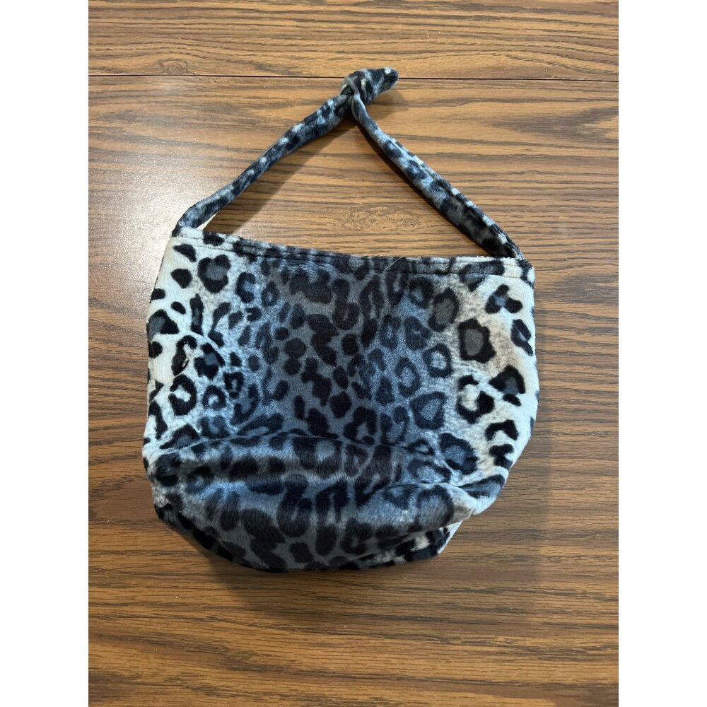Black, white, and grey fuzzy leopard print zippered tote bag